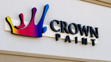 A channel letter sign install on a paint shop with the name of crown paint