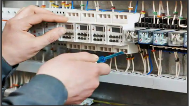 Electrician fixing electrical board