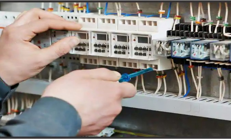 Electrician fixing electrical board